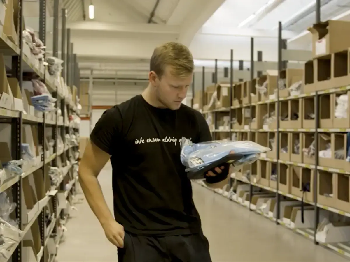 Kids-Brand-Store warehouse worker using Bitlog WMS on tablet