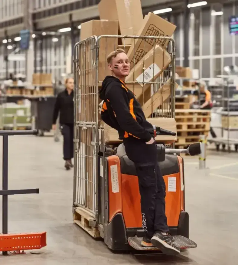 Nordic-Nest warehouse worker on fork lift